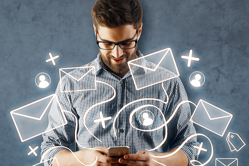 Man using smartphone with email network